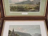 two framed pictures of a landscape with a lake and mountains