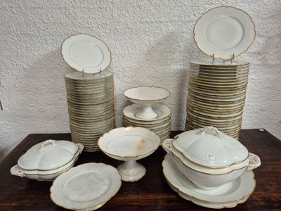 a lot of plates and bowls on a table