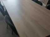 a long table with chairs around it in a room