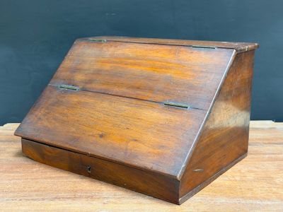 an old wooden box sitting on top of a wooden table