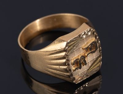 an image of a gold signet ring with an elephant on it