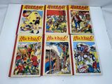 four vintage children ' s comic books are on display on a white surface