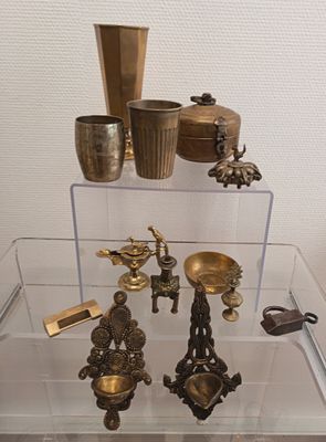 a glass display case with a lot of different items on it