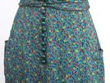 a close up of a skirt with buttons on it