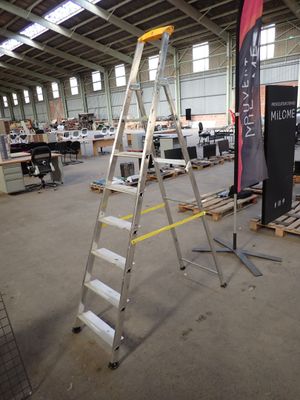 a ladder in the middle of a large room