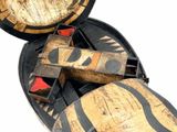 a wooden object that is sitting inside of a case