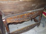 a wooden table with a drawer on top of it