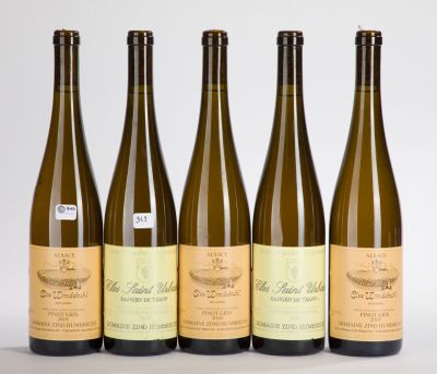 four bottles of wine sitting next to each other on a table