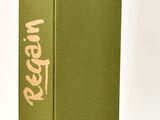 the book is green and has a pink writing on the cover