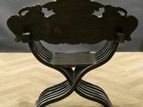 a wooden chair that is sitting on a wooden floor