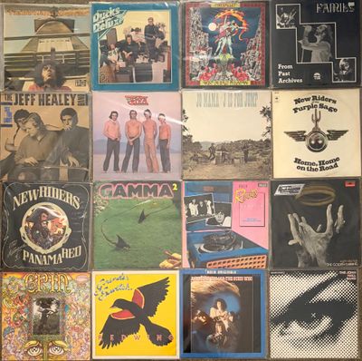 a collage of posters on the wall of a room