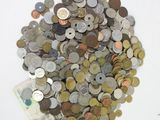 a pile of coins sitting on top of a white table