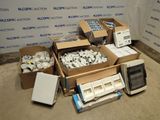 several boxes of electronic equipment are sitting on the floor