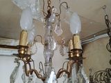 a chandelier that has a lot of glass hanging from it