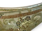 a glass bowl with a decorative design on it