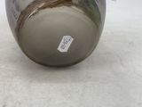 a vase that has a picture of a tree on it