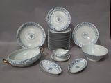 a lot of plates and bowls sitting on a table