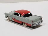a toy car that is sitting on a white surface