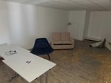 two chairs and a table in a room with wood flooring