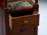 an antique wooden dresser with a marble top and drawers