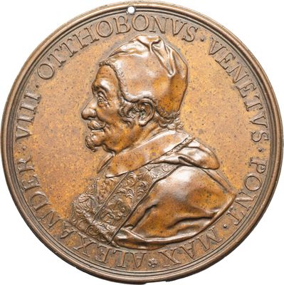 un gros plan d'une médaille de bronze sur laquelle figure le visage d'un homme