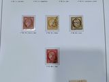 many different stamps on a sheet of paper on a table