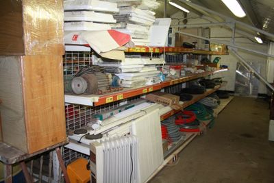 a room with a lot of items on the shelves