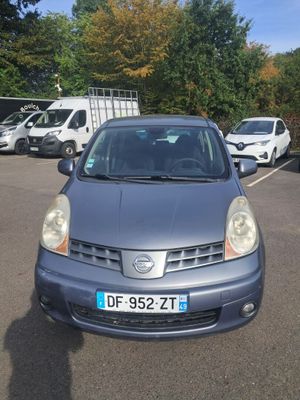 a small car that is parked in a parking lot