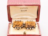 an image of a pair of cuff rings in a red box