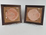 pair of wooden picture frames with pink and brown paint on them