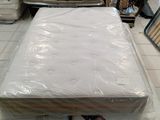 a mattress that is sitting on the floor in a room