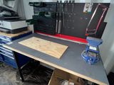 a workbench with a lot of tools on it