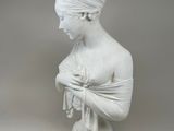 statue of a woman in a turban holding a bird