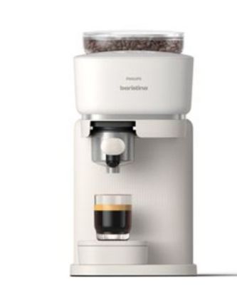 une machine à café sur laquelle est posée une tasse de café