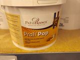 a bucket of peanut pop on a shelf in a store