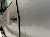 a silver van that is parked in a garage