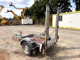 an image of a trailer with a crane in the background