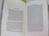 an open book that is sitting on a table