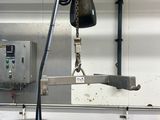 a picture of a machine that is working on a piece of metal
