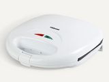 une image représentant un grille-pain blanc orné d'un motif rouge, vert et blanc