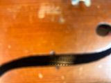 a close up of a violin that is on a table