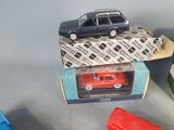several toy cars are stacked on top of each other on a table