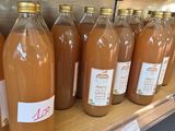 bottles of apple cid sit on a shelf in a store