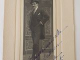 an old photo of a man in a suit and top hat