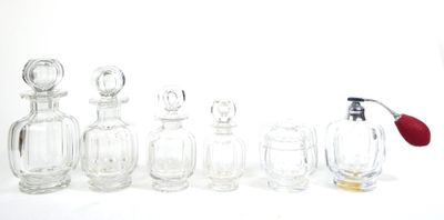 a lot of glass bottles that are lined up on a table