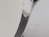 a close up of a clock that is on a table