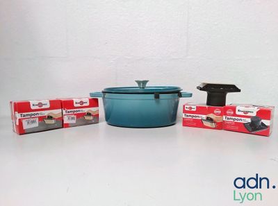 a blue pot sitting next to a box of soap