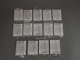 a lot of tags on a table that have been wrapped in plastic