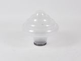 a close up of a plastic mushroom shaped object on a white surface