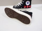 a pair of black and white converses with red hearts on them